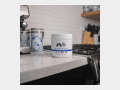 Momentous - Collagen  Peptides container on kitchen counter